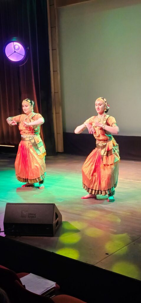 Two dancers are dancing